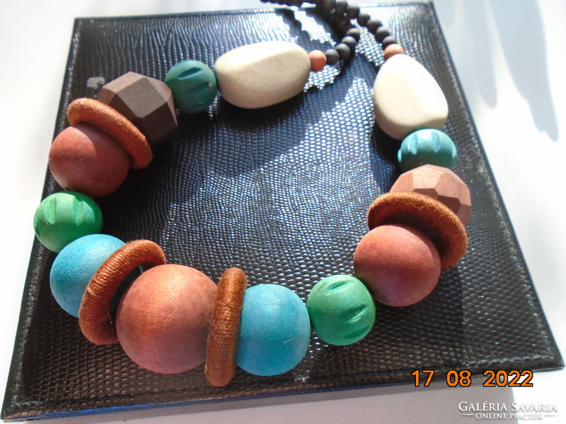Large necklace of painted wooden beads of different shapes and colors