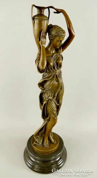 Women carrying water - bronze statue