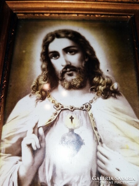 Old picture of the heart of Jesus, under glass with a wooden frame, farmhouse decoration