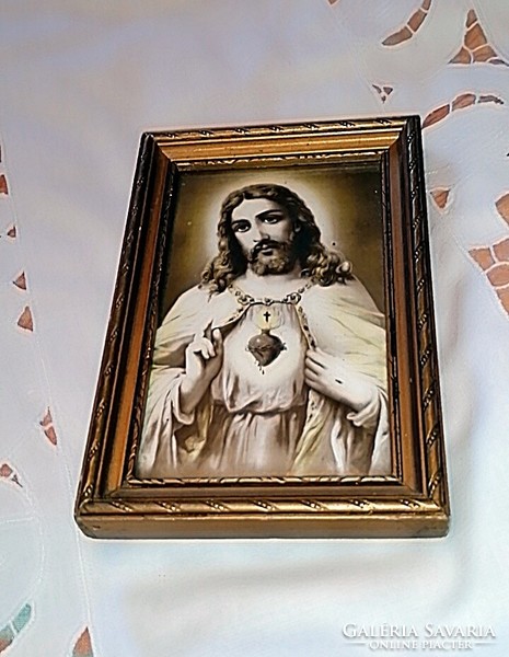 Old picture of the heart of Jesus, under glass with a wooden frame, farmhouse decoration