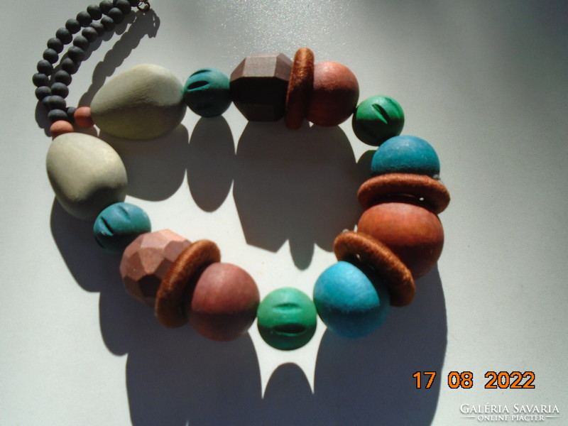 Large necklace of painted wooden beads of different shapes and colors