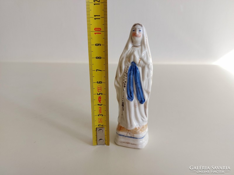 Old religious figure porcelain statue of Mary