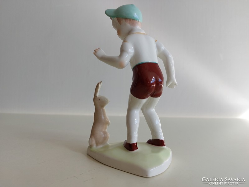 Old aquincum Budapest porcelain figurine of a boy with a bunny