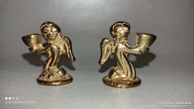 Miniature copper angel in pair of candle holders