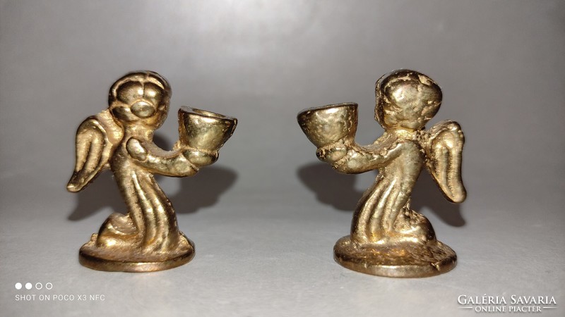 Miniature copper angel in pair of candle holders