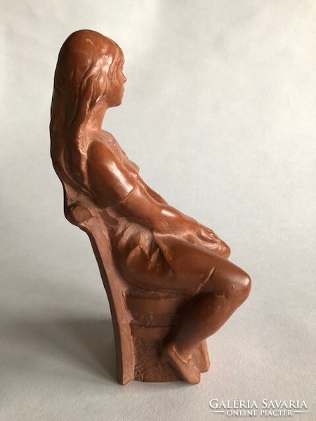 Seated sculpture of a young girl (terracotta) made of black gauze