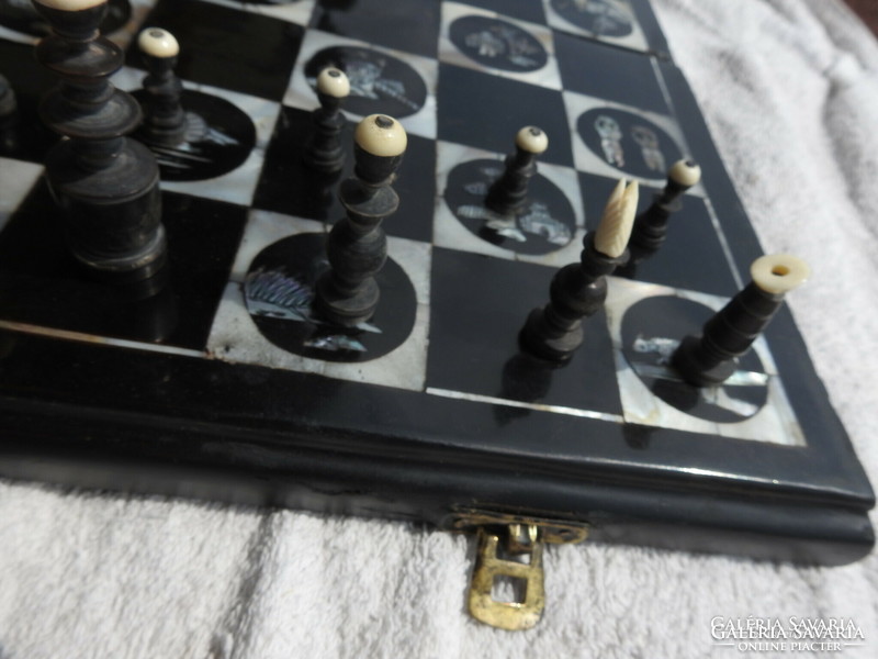 Antique oriental chess set with pearl board with bone-shaped wooden figures