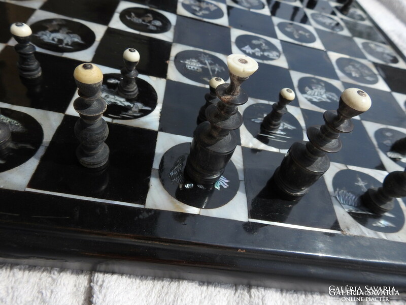 Antique oriental chess set with pearl board with bone-shaped wooden figures