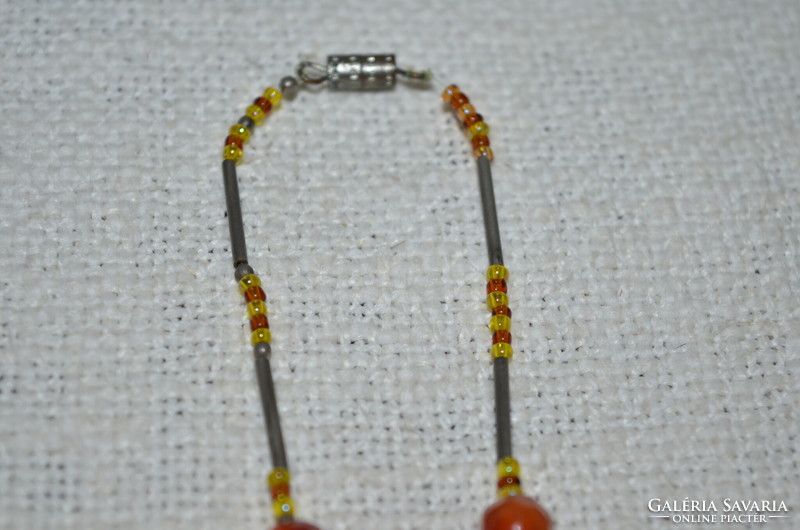 Glass and metal decorated necklace