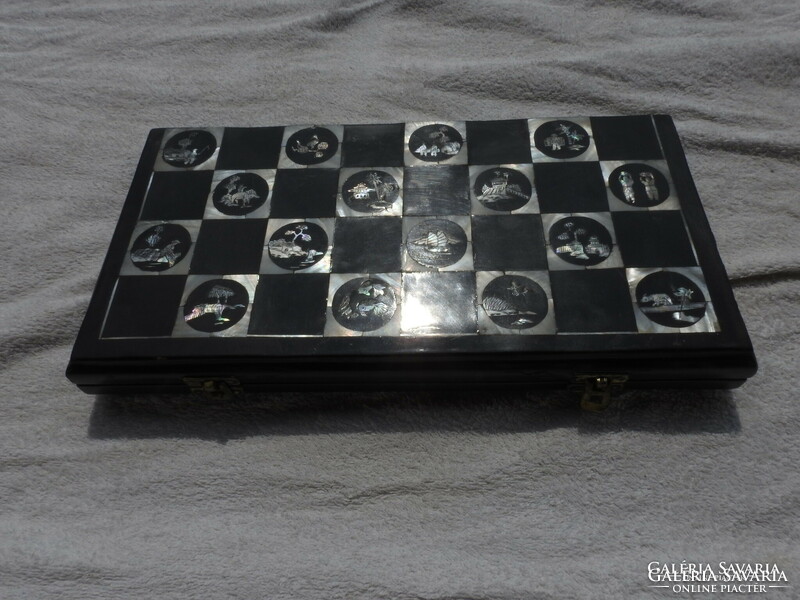 Antique oriental chess set with pearl board with bone-shaped wooden figures