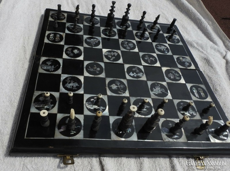 Antique oriental chess set with pearl board with bone-shaped wooden figures