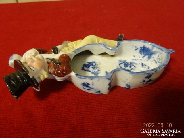 German porcelain centerpiece with a musical figure on the side. He has! Jokai.