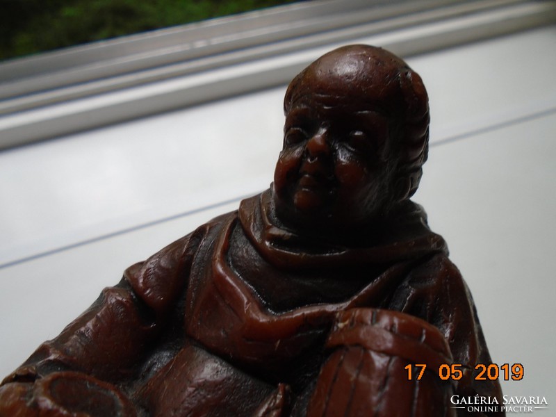 Crouching monk with a small barrel, wax figure 17 cm