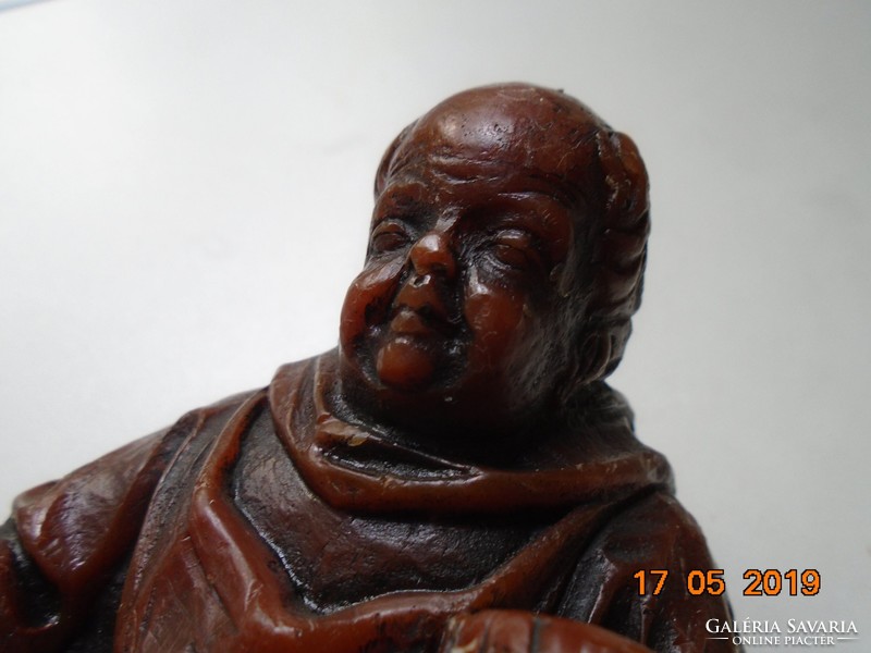 Crouching monk with a small barrel, wax figure 17 cm