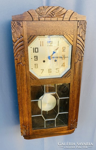 Carved wood oven wall clock.