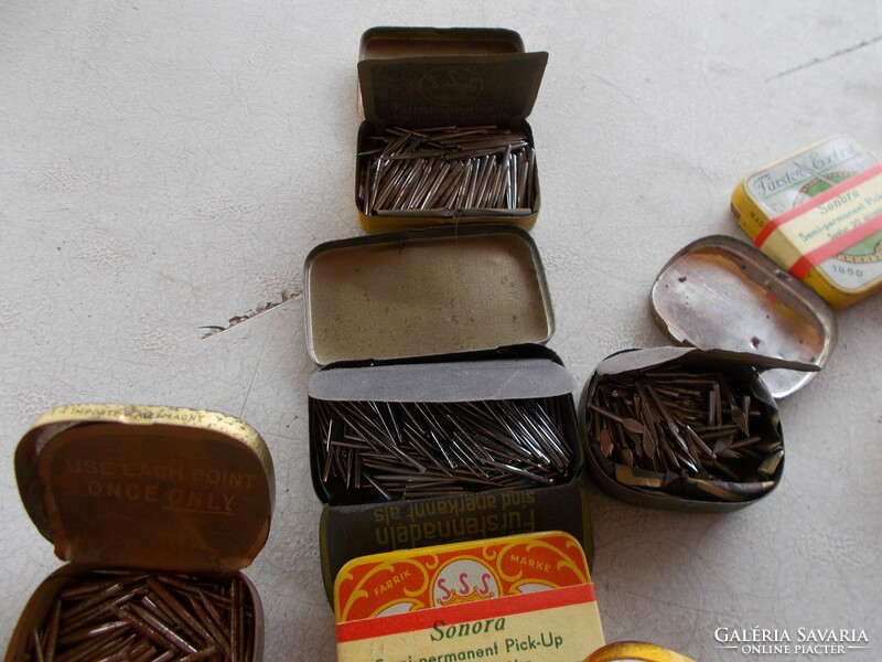 17 old gramophone metal boxes, with contents, in a sheet corresponding to their age