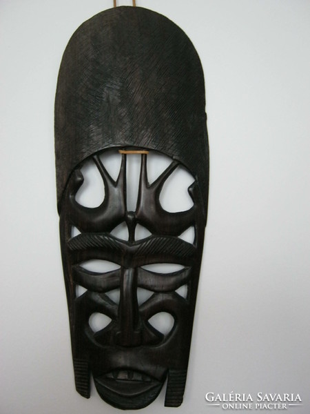 Wooden mask with exotic wall ornament