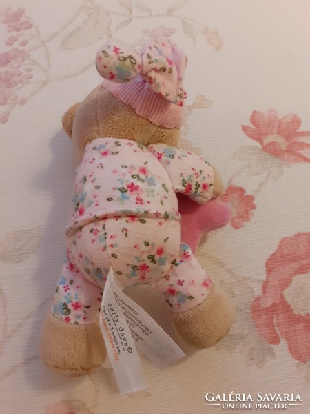 Teddy bear - early days plush bear in pajamas with a cap and a pink star in his hand