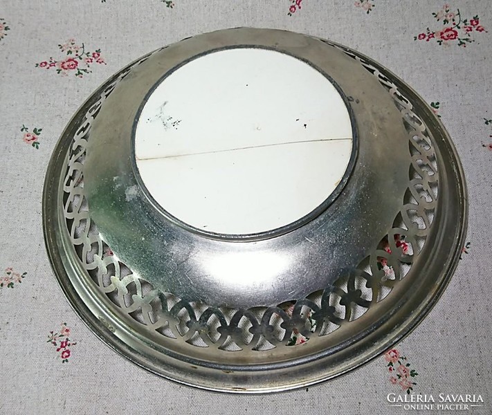 Fruit serving bowl with metal porcelain insert base with openwork sides.