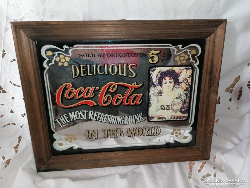 Old coca cola advertising decorative mirror image in a wooden frame