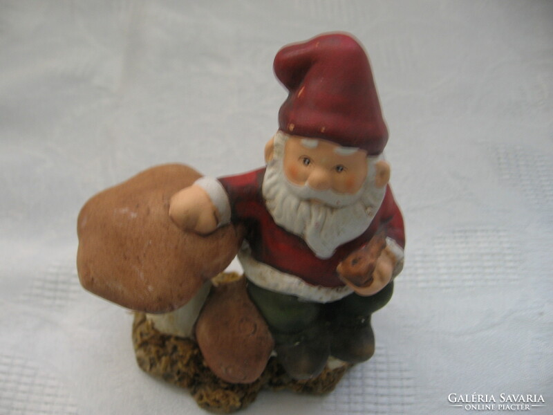 Retro Christmas elf, a dwarf figure with a mushroom