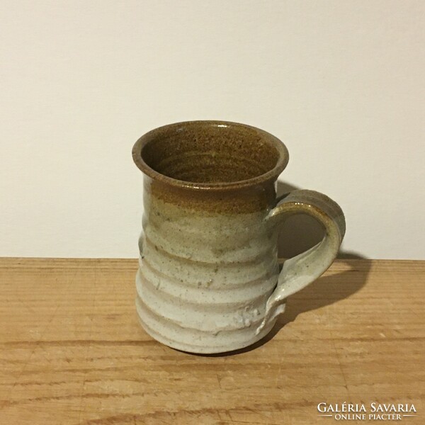 Ceramic pitcher with stone effect