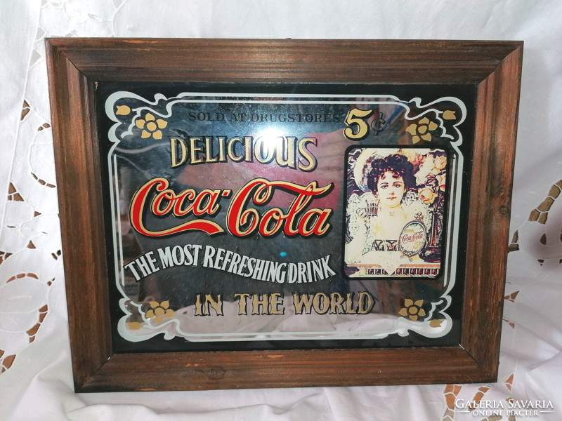 Old coca cola advertising decorative mirror image in a wooden frame