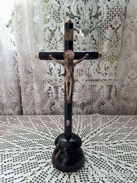 Old very beautiful wooden cross with metal Jesus