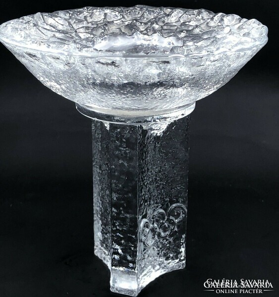 A pair of Orrefors candle holders is a product of the world-famous Swedish glass manufactory. 