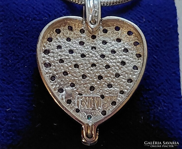 Beautiful silver pendant with iridescent sparkling zirconia stones on a snake chain