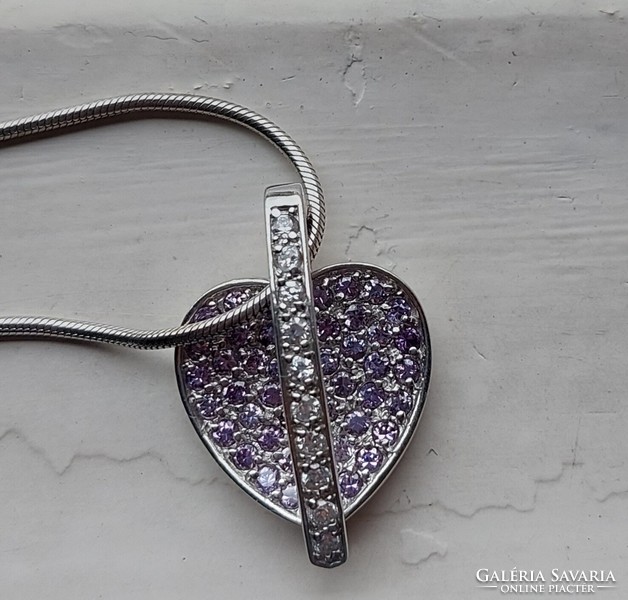 Beautiful silver pendant with iridescent sparkling zirconia stones on a snake chain