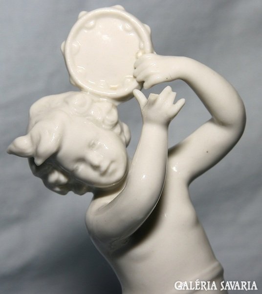 An antique Neapolitan porcelain figurine shaping an angel, a small flaw