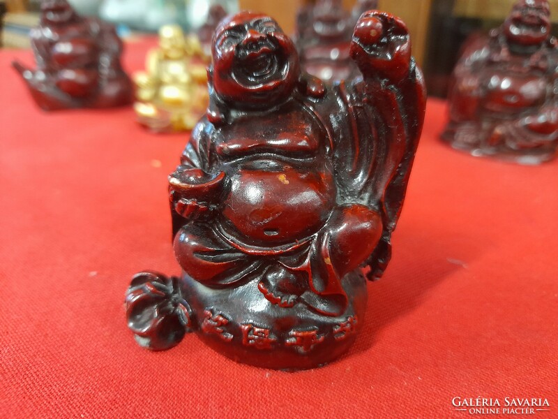 Religious laughing Buddha plastic figural statue.