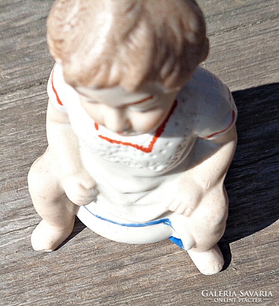Old biscuit porcelain bilin sitting boy money box figurine