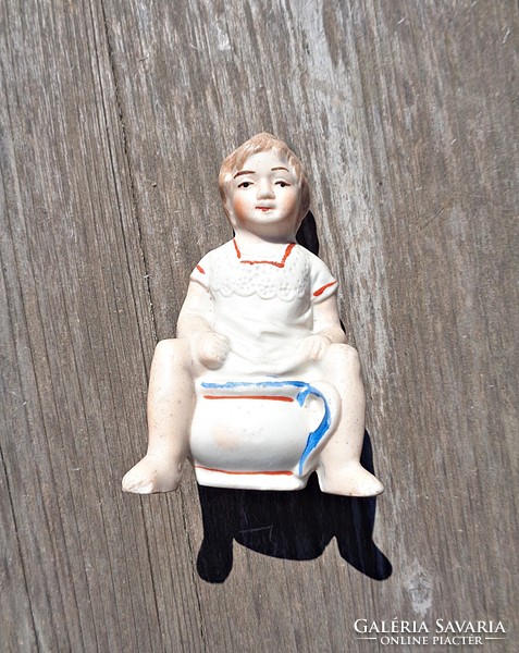 Old biscuit porcelain bilin sitting boy money box figurine