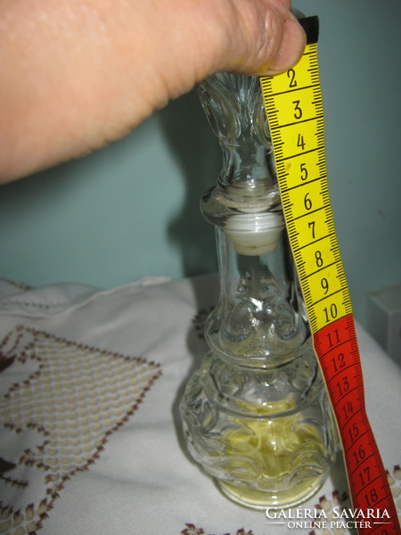 Old big perfume bottle with tiny perfume