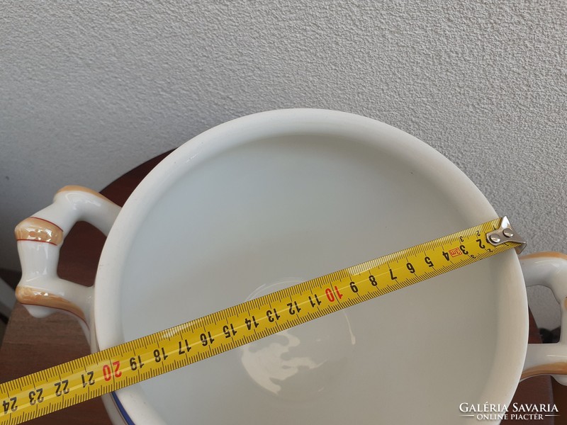 Old porcelain blue striped comma folk bowl with white soup