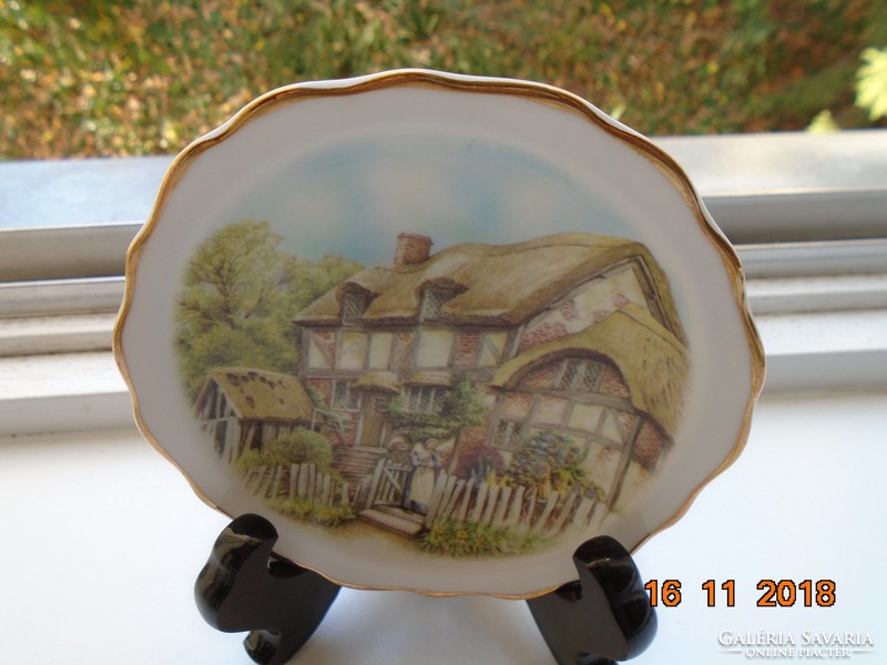 Decorative small plate with a Victorian village image from the 