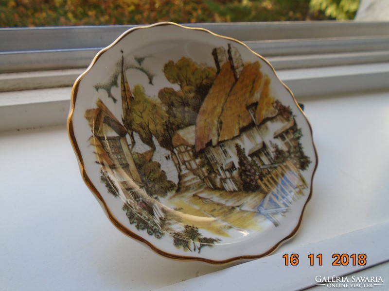 Decorative small plate with a Victorian village picture from the heritage regency series