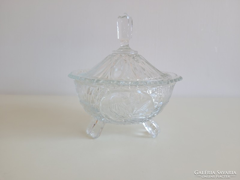 Old large glass bonbonier retro sugar bowl with a bird pattern on the lid