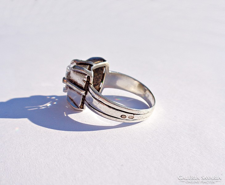Silver ring made in a large polished stone mint
