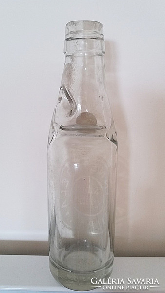 Old ball of soda bottle from géla Binner brewery with pair of soda bottles