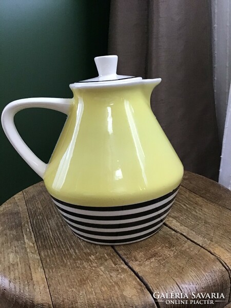 Old retro faience tea pourer