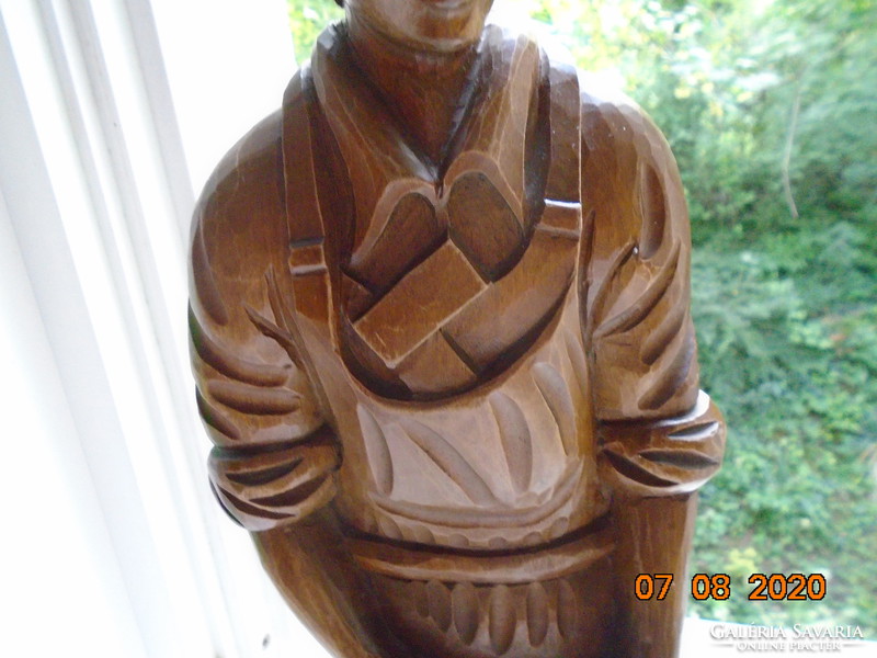 The master carpenter is a large statue carved from a piece of wood