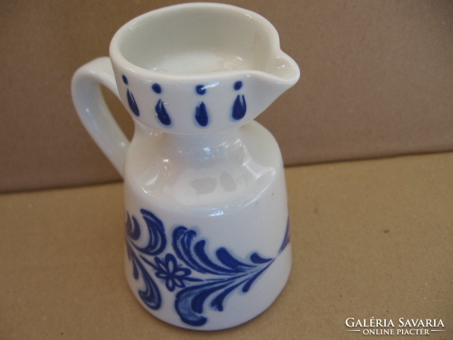 Small numbered shabby jug in vase