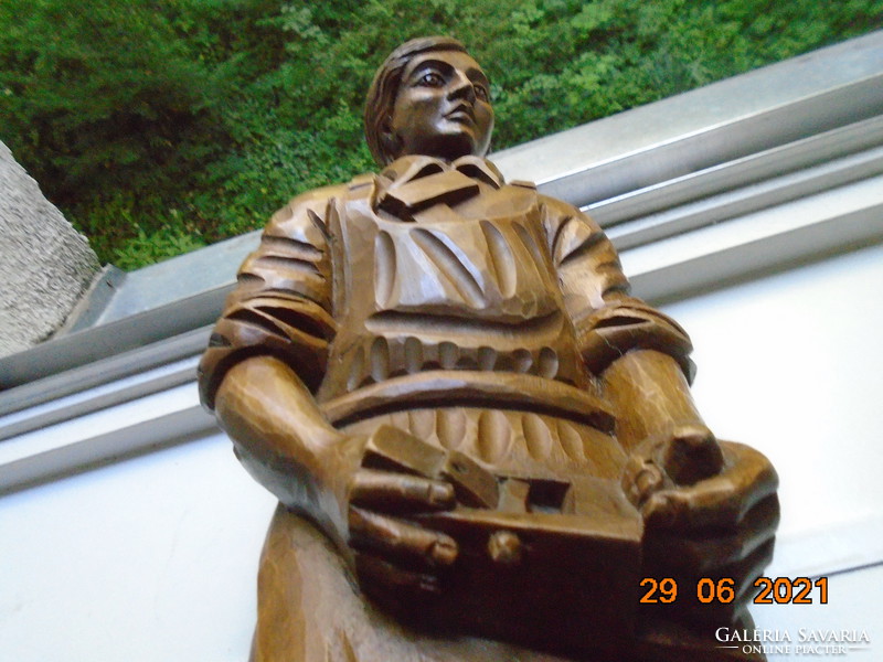 The master carpenter is a large statue carved from a piece of wood