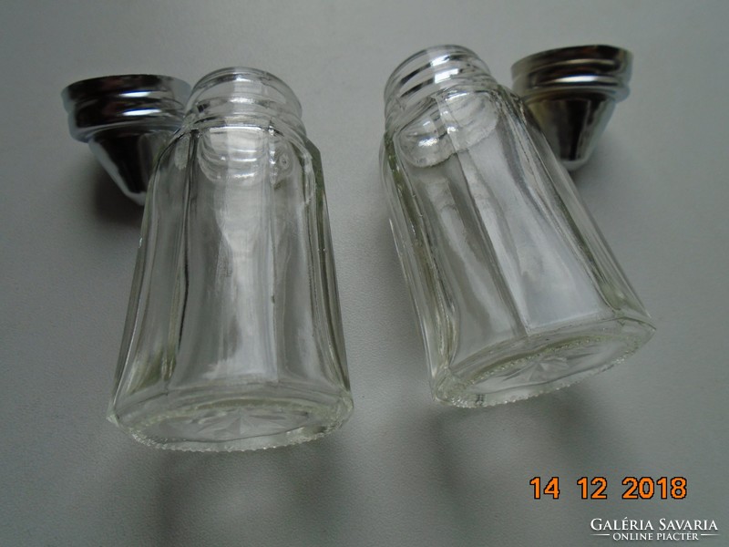 2 octagonal glass spice dispensers in a chromed metal holder