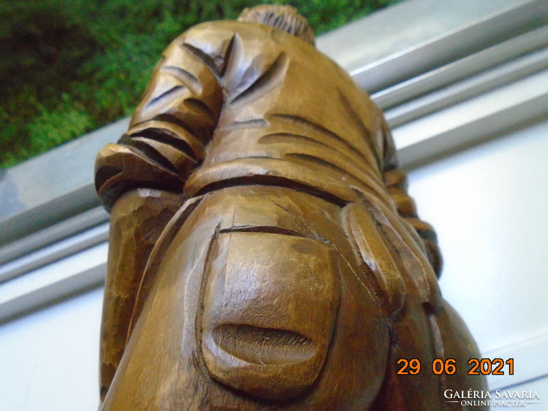 The master carpenter is a large statue carved from a piece of wood