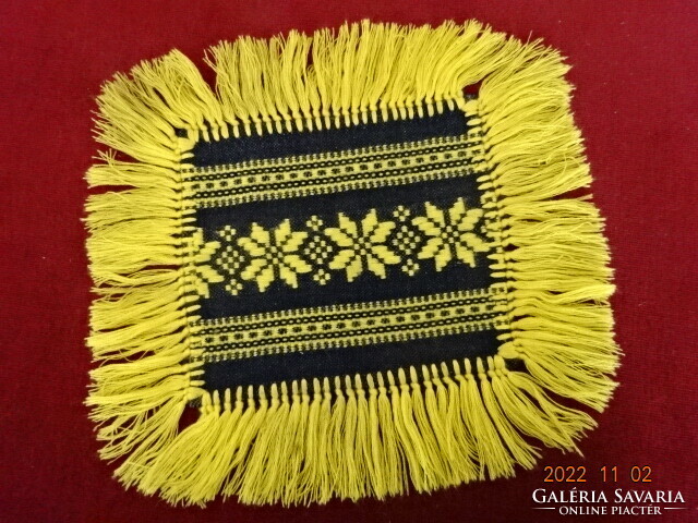 Embroidered black placemat with yellow fringe and embroidery. He has! Jokai.