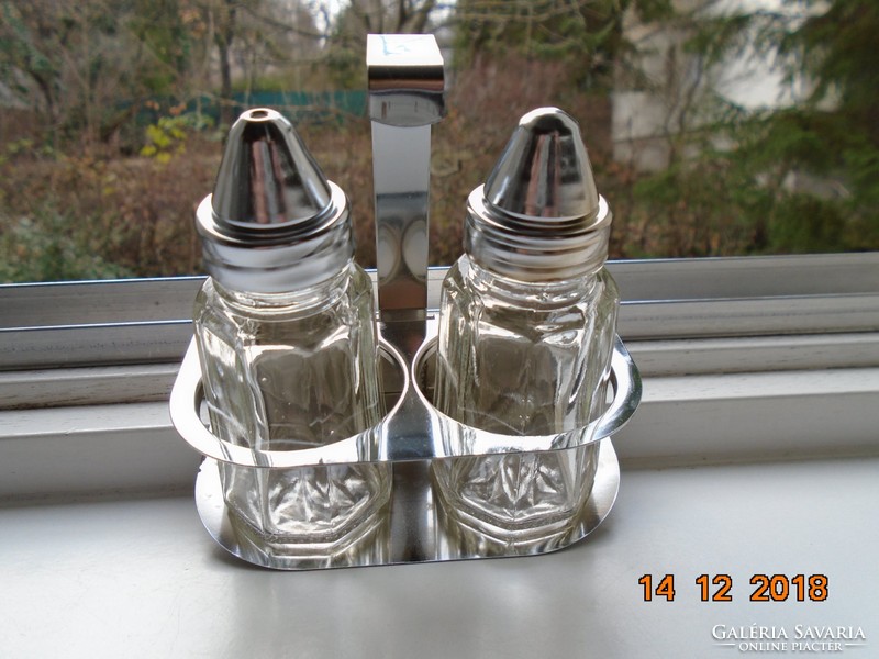 2 octagonal glass spice dispensers in a chromed metal holder